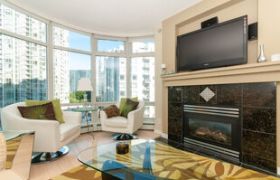 Furnished 1-bedroom + den condo with city view, modern decor, and in-suite laundry.