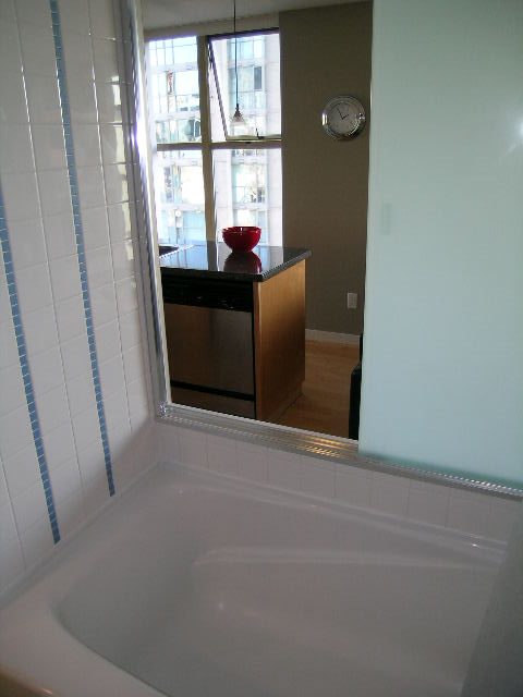 Bright kitchen with hardwood floors, city view, and modern decor. - 703 - 1000 Beach Avenue, Vancouver Downtown