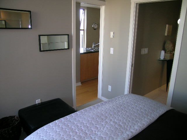 Bright bedroom with hardwood floors and a view of the kitchen. - 703 - 1000 Beach Avenue, Vancouver Downtown