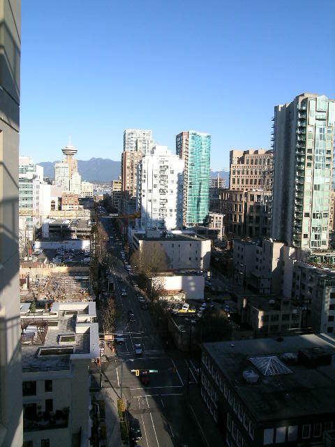 Bright living room with stunning city view and modern furnishings. - 703 - 1000 Beach Avenue, Vancouver Downtown