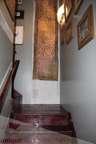 Furnished staircase with wooden steps and framed artwork. - 627 - 289 Alexander Street, Vancouver Downtown