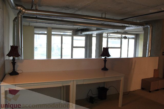 Furnished loft with white countertops and large windows, natural light. - 627 - 289 Alexander Street, Vancouver Downtown