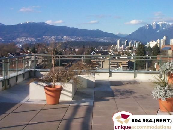 Furnished rooftop patio with city view and potted plants. - 700 - 1888 York Ave, Vancouver West Side