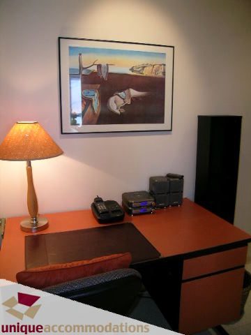 Furnished living area with a desk, lamp, and framed artwork. - 509 - 939  Homer Street, Vancouver Downtown
