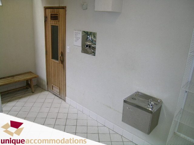Bathroom with tiled floor, wooden bench, and water fountain. - 509 - 939  Homer Street, Vancouver Downtown