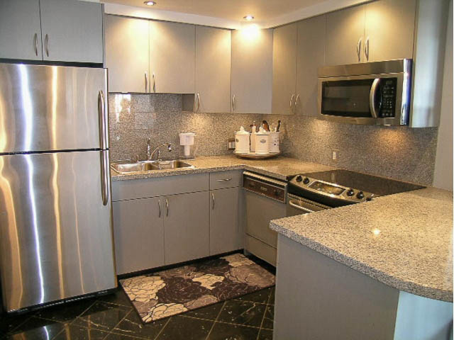 Bright kitchen with granite countertops and stainless steel appliances, modern design. - 1402 - 1625 Hornby, Vancouver Downtown
