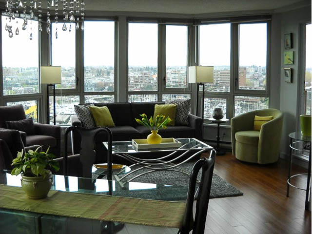 Bright living room with large windows, hardwood floors, and a city view. - 1402 - 1625 Hornby, Vancouver Downtown