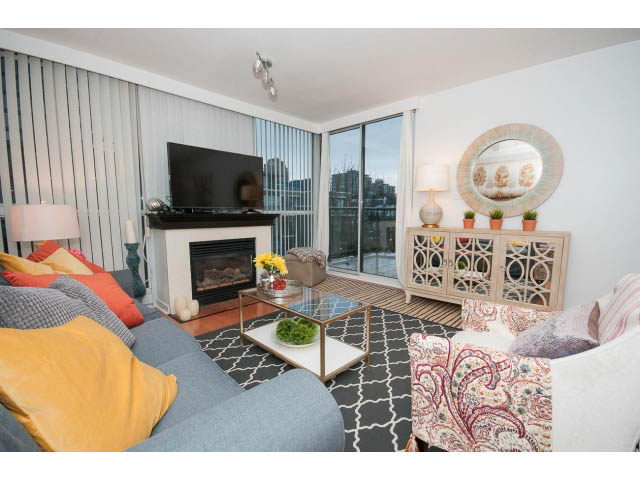 Bright living room with city view, modern decor, and cozy furnishings. - 407 - 1485 West 6th Ave, Vancouver West Side