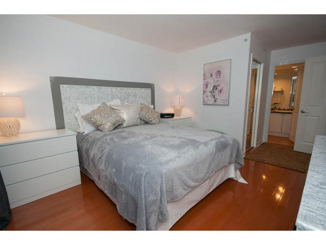 Furnished 2-bedroom condo with hardwood floors and a modern, cozy bedroom setup. - 407 - 1485 West 6th Ave, Vancouver West Side