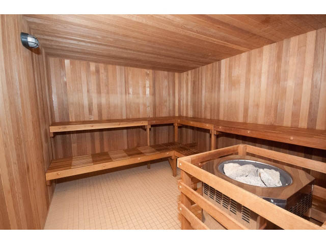 Furnished sauna with wooden benches and stone heater. - 407 - 1485 West 6th Ave, Vancouver West Side