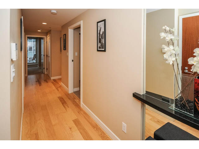 Furnished hallway with hardwood floors and a glass-top coffee table. - 1604 - 1233 West Cordova Street, Vancouver Downtown