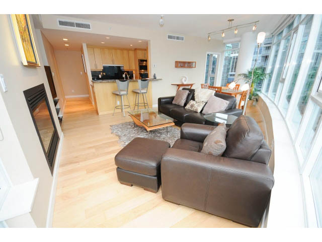 Furnished living room with hardwood floors, city view, and modern decor. - 1604 - 1233 West Cordova Street, Vancouver Downtown