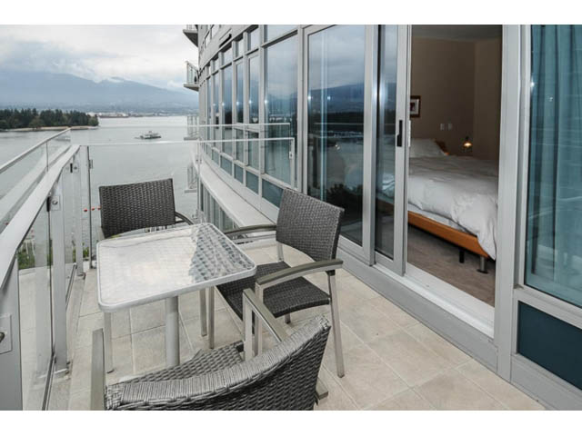 Bright living room with large windows, city view, and modern furniture. - 1604 - 1233 West Cordova Street, Vancouver Downtown