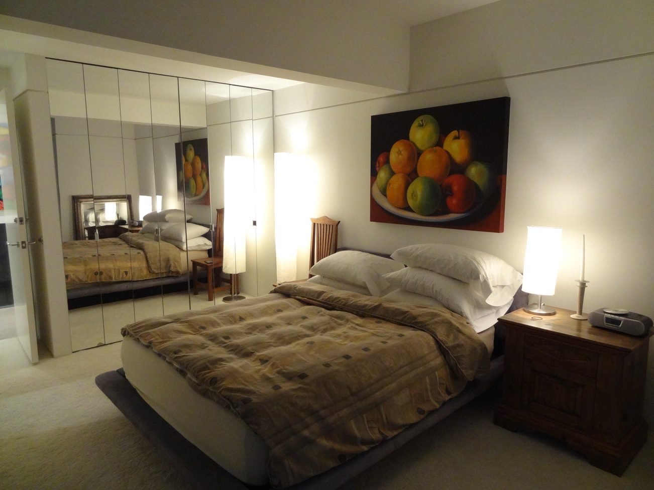Furnished 3-bedroom + den with mirrored closet and fruit painting above bed. - 2898 Bellevue Avenue, West Vancouver