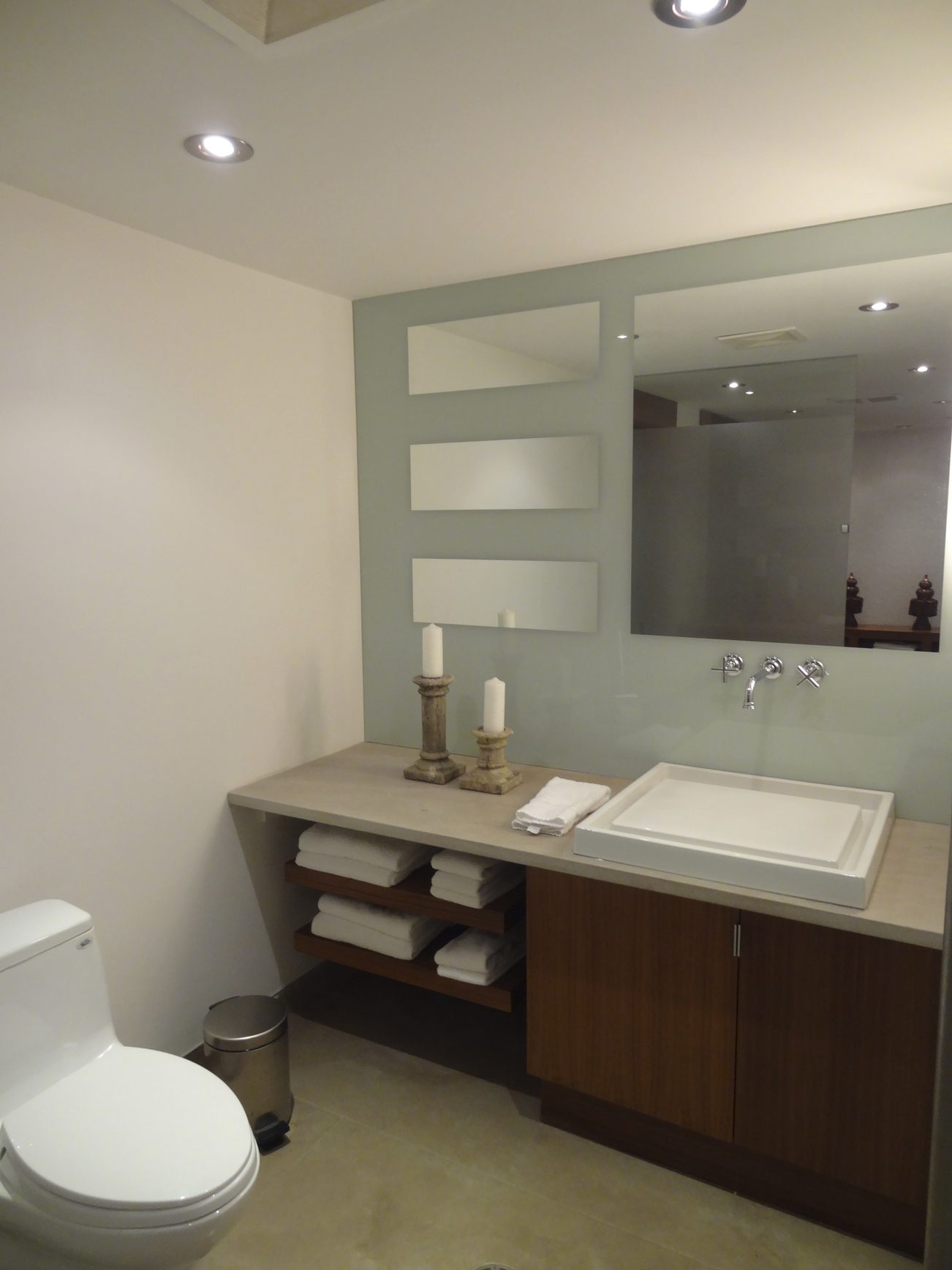 Furnished bathroom with modern sink, storage shelves, and decorative candles. - 2898 Bellevue Avenue, West Vancouver