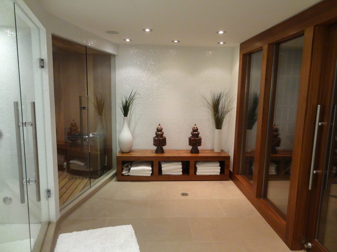 Spacious bathroom with glass shower, wooden shelves, and decorative plants. - 2898 Bellevue Avenue, West Vancouver