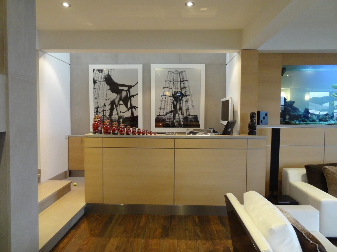 Furnished living room with modern decor, hardwood floors, and a cityscape artwork. - 2898 Bellevue Avenue, West Vancouver
