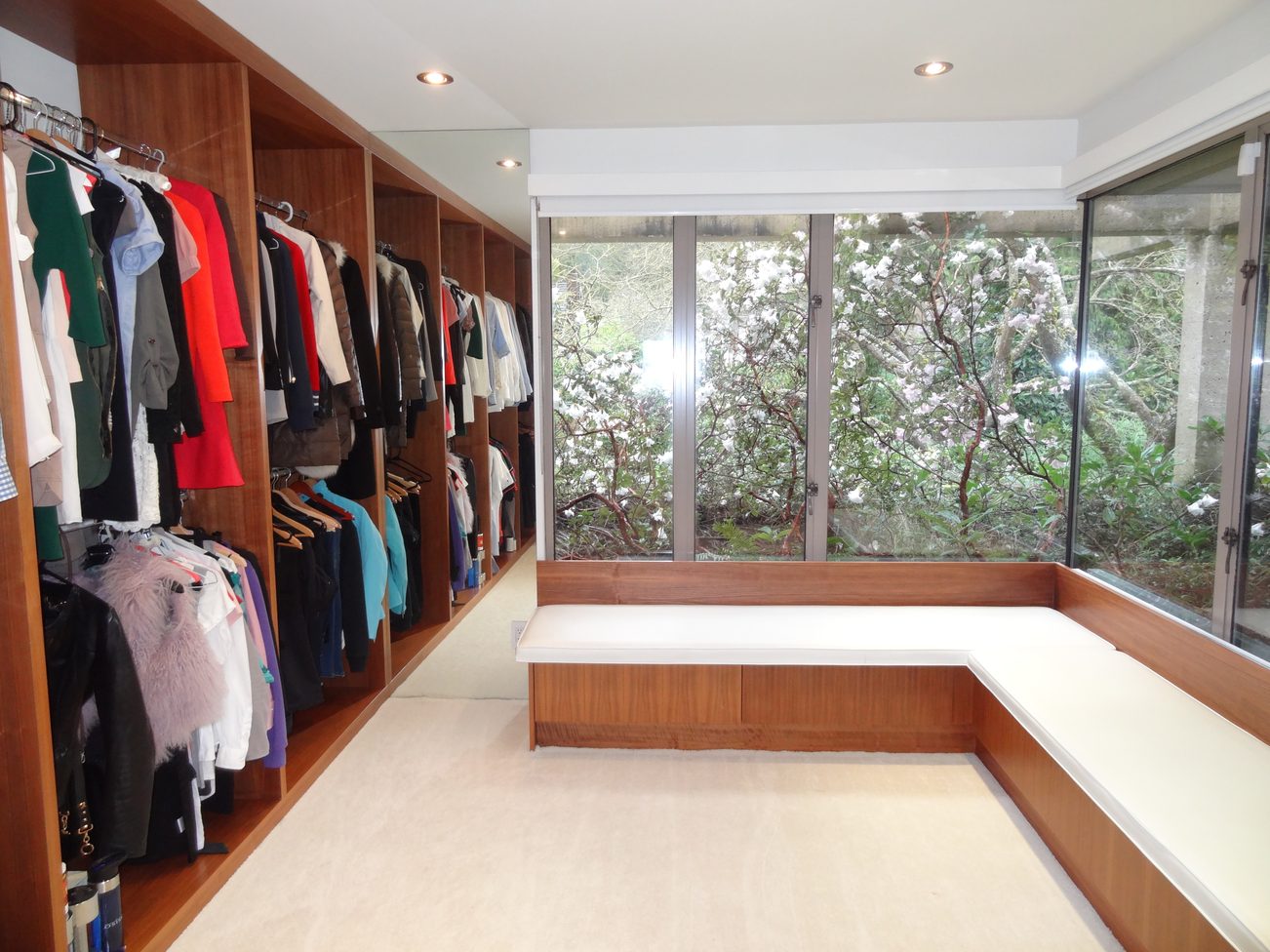 Spacious walk-in closet with ample storage and a view of blooming trees. - 2898 Bellevue Avenue, West Vancouver