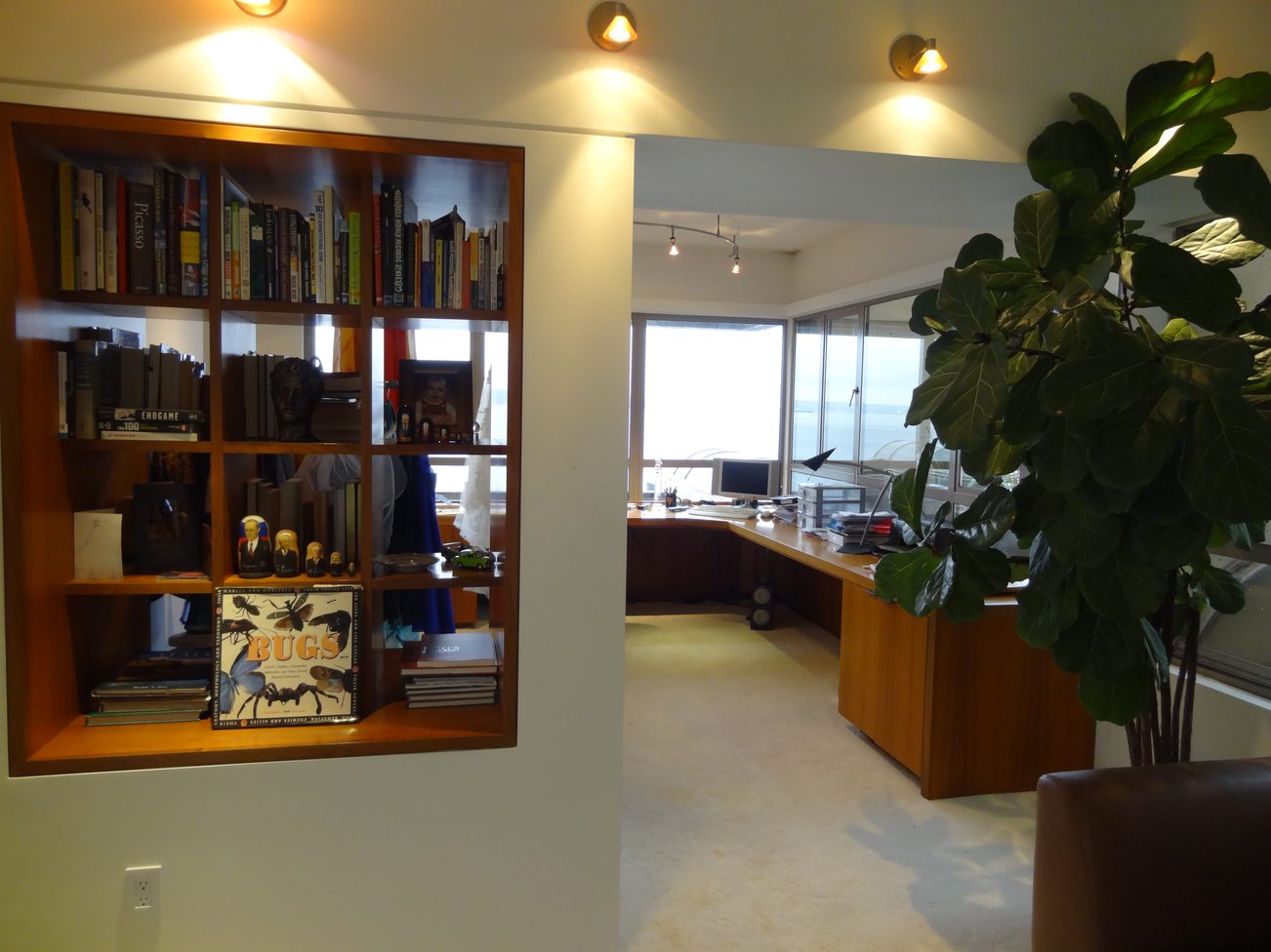 Furnished living room with bookshelves, desk, and city view. - 2898 Bellevue Avenue, West Vancouver