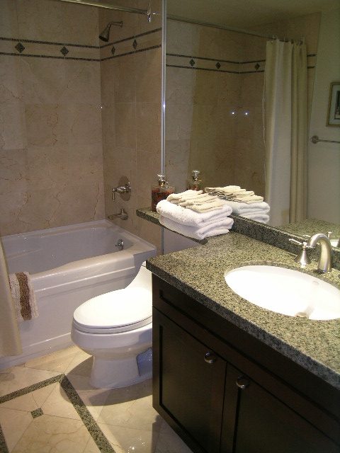 Spacious bathroom with granite countertops and a modern sink setup. - 1035 Marinaside Crescent, Vancouver Downtown