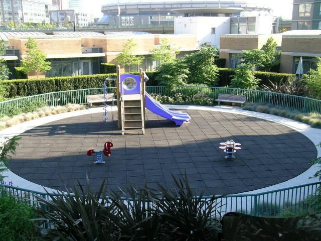 Spacious patio with playground equipment and city views. - 1035 Marinaside Crescent, Vancouver Downtown