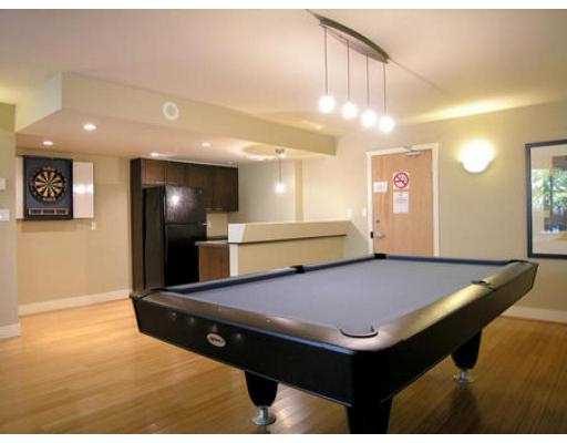 Spacious living room with pool table, hardwood floors, and modern decor. - 409 - 969 Richards Street, Vancouver Downtown