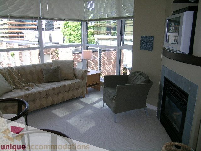 Furnished living room with city view and modern decor. - 707 - 1068 Hornby Street, Vancouver Downtown
