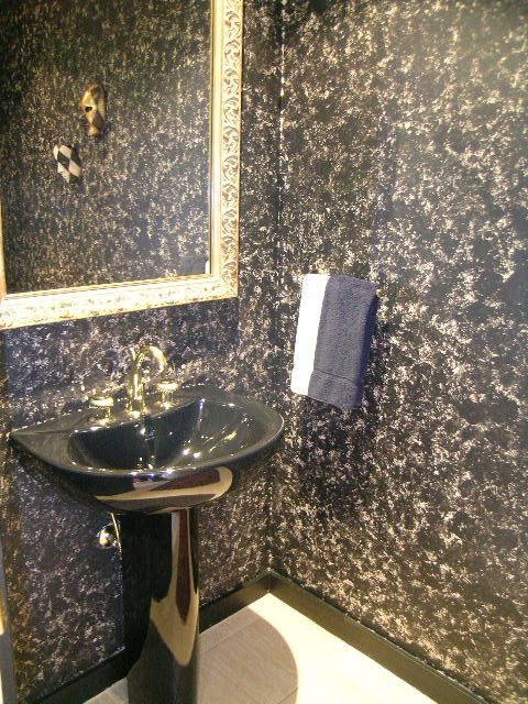 Bathroom with black speckled walls, modern sink, and chrome fixtures. - 4527 Stonehaven Avenue, North Vancouver