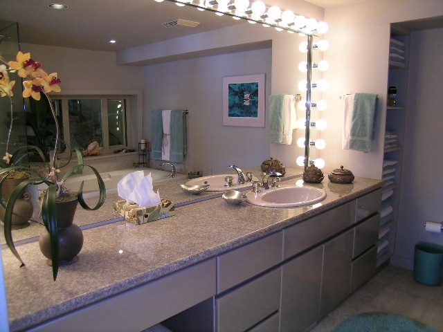 Bathroom with granite countertops, double sinks, and vanity lights. - 4527 Stonehaven Avenue, North Vancouver