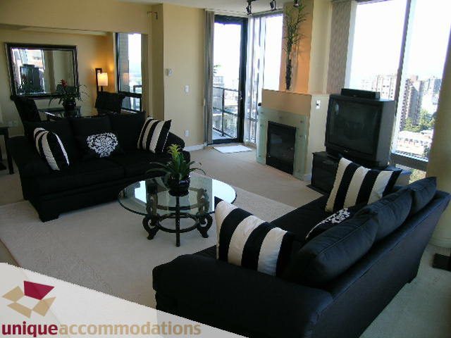 Spacious living room with city view, modern furniture, and large windows. - 1808 - 1003 Burnaby Street, Vancouver Downtown