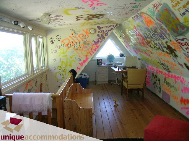 Attic bedroom with graffiti walls and wooden floors. - 3664 Creery Ave., West Vancouver