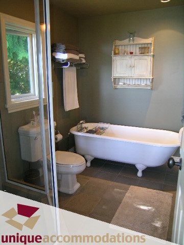 Bright bathroom with white countertop and shower, modern design. - 3664 Creery Ave., West Vancouver