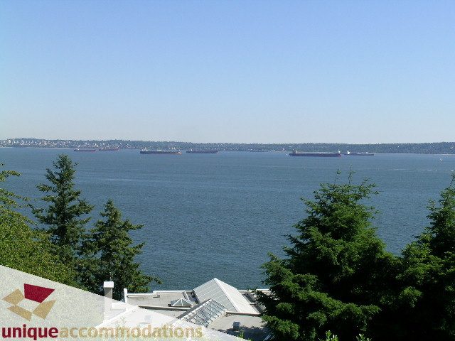 Furnished living room with city view and waterfront access. - 3664 Creery Ave., West Vancouver