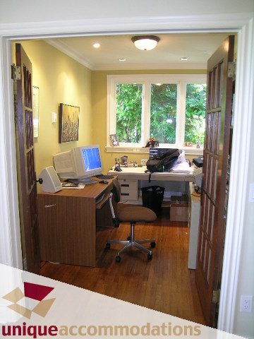 Bright home office with hardwood floors, desk, and large windows. - 3664 Creery Ave., West Vancouver