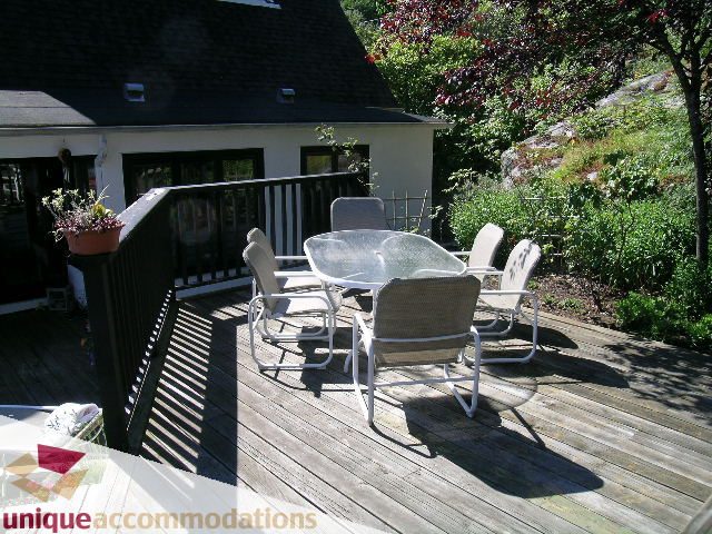 Furnished patio with outdoor furniture and greenery, perfect for relaxation. - 3664 Creery Ave., West Vancouver