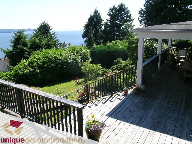 Furnished deck with ocean view and lush greenery. - 3664 Creery Ave., West Vancouver