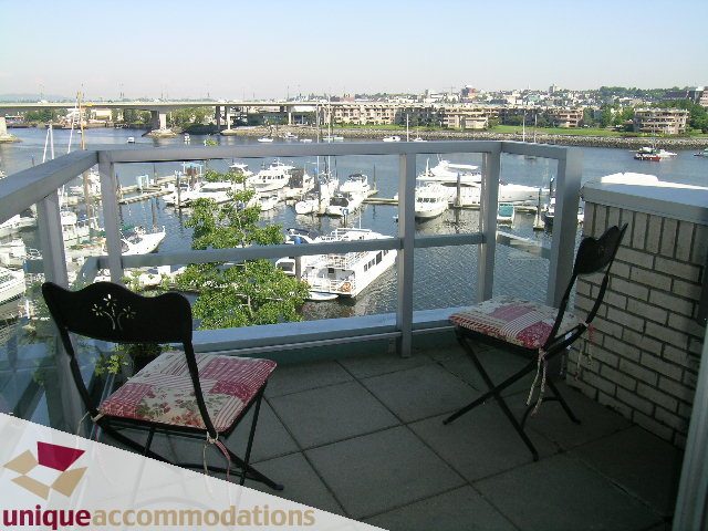 Furnished balcony with harbor view and patio furniture. - 322 - 1228 Marinaside Crescent, Vancouver Downtown