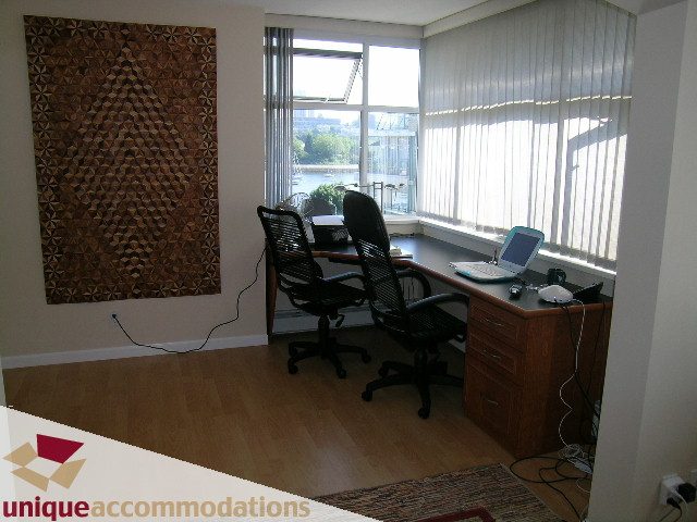 Furnished office with hardwood floors, city view, and modern decor. - 322 - 1228 Marinaside Crescent, Vancouver Downtown