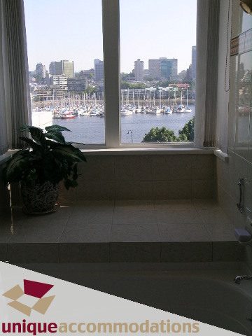 Furnished bathroom with a view of marinaside and downtown Vancouver. - 322 - 1228 Marinaside Crescent, Vancouver Downtown