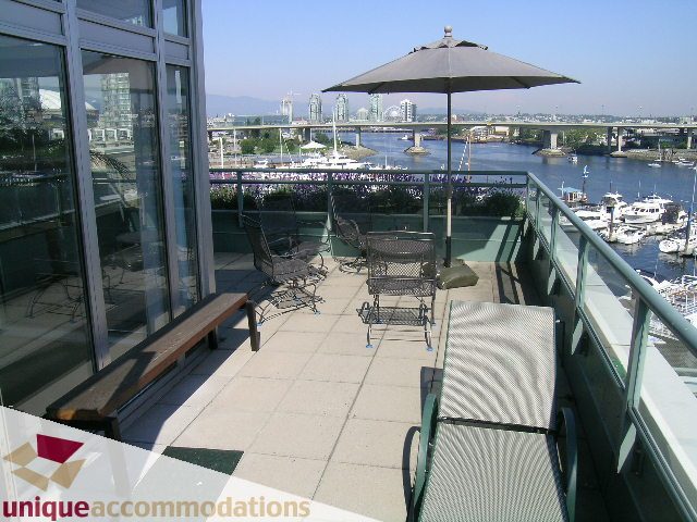 Furnished patio with city view and waterfront access. - 322 - 1228 Marinaside Crescent, Vancouver Downtown