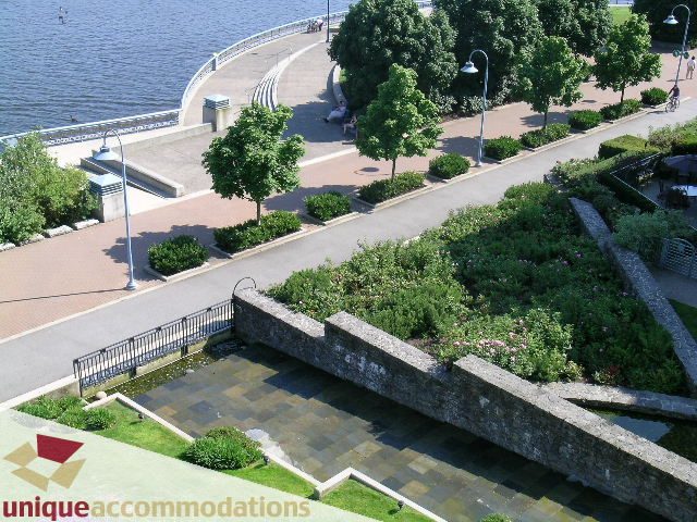 Furnished living room with waterfront view and garden. - 322 - 1228 Marinaside Crescent, Vancouver Downtown