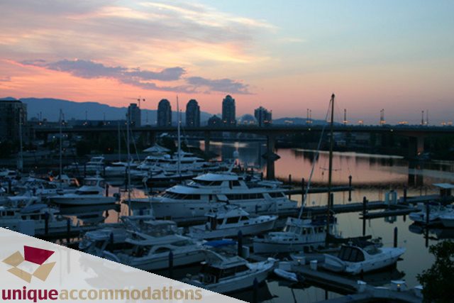 Furnished 2-bedroom + den townhouse with a stunning city view at dusk. - 322 - 1228 Marinaside Crescent, Vancouver Downtown