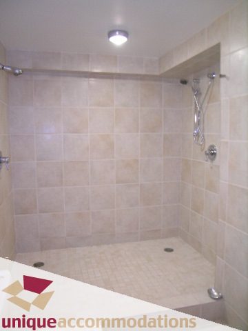 Spacious shower with beige tiles and modern fixtures. - 401 - 2525 Quebec Street, Vancouver East Side
