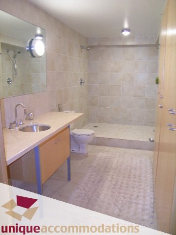 Furnished bathroom with light wood cabinets and a modern sink. - 401 - 2525 Quebec Street, Vancouver East Side
