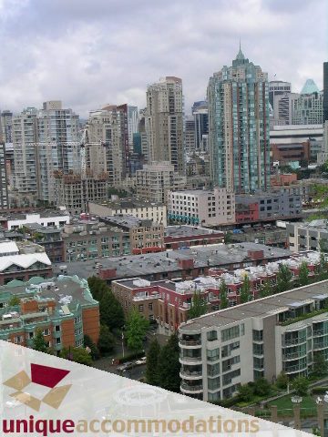 Bright kitchen with city view and modern furnishings. - 2502 - 1077 Marinaside Crescent, Vancouver Downtown