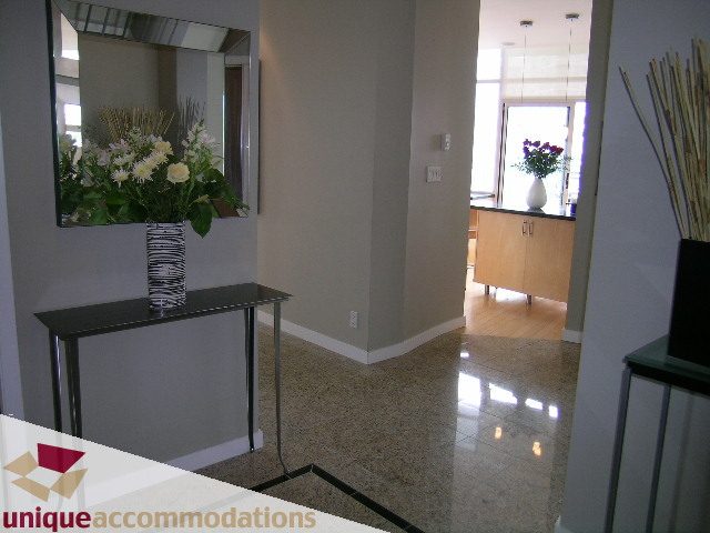 Furnished entryway with granite countertops and modern decor. - 2502 - 1077 Marinaside Crescent, Vancouver Downtown