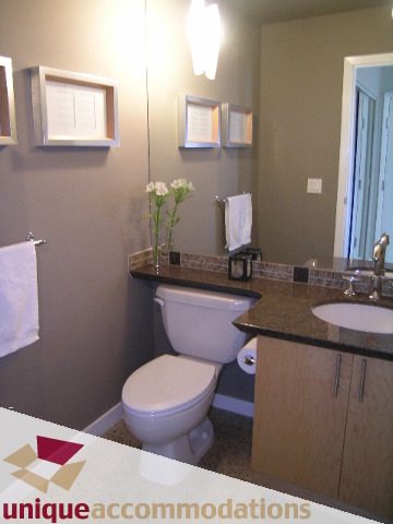 Furnished bathroom with granite countertops and a modern sink. - 2502 - 1077 Marinaside Crescent, Vancouver Downtown