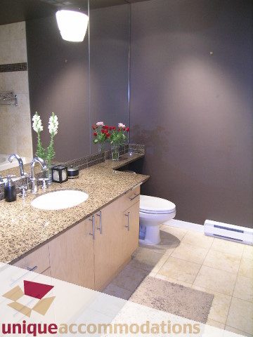 Furnished bathroom with granite countertops and a modern sink setup. - 2502 - 1077 Marinaside Crescent, Vancouver Downtown