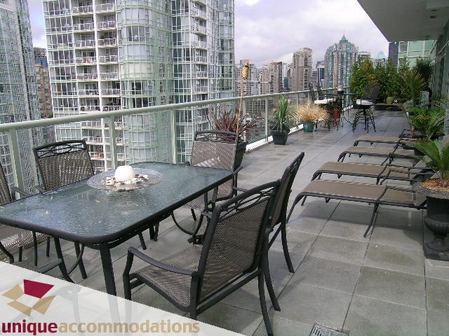 Furnished balcony with outdoor seating and city view. - 2502 - 1077 Marinaside Crescent, Vancouver Downtown
