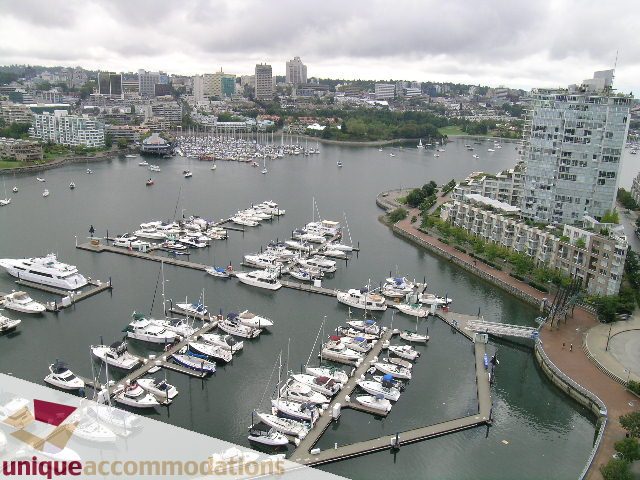 Furnished 2-bedroom + den condo with a stunning marina view and cityscape in the background. - 2502 - 1077 Marinaside Crescent, Vancouver Downtown